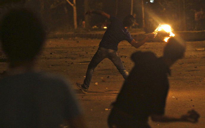 Protesters opposing Egyptian President
  Mohamed Mursi throw Molotov cocktails and stones at the national
  headquarters of the Muslim Brotherhood in Cairo's Moqattam
  district June 30, 2013. (Reuters)