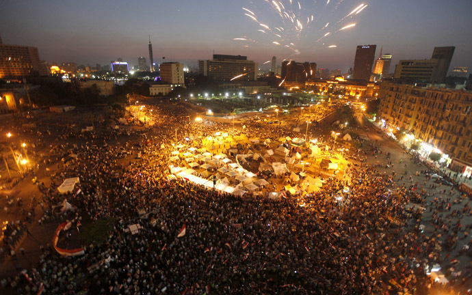 Protesters opposing
  Egyptian President Mohamed Morsi shout slogans and set off
  fireworks during a protest in Tahrir square in Cairo June 29,
  2013. (Reuters)