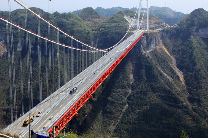 The Aizhai bridge, the worldís highest tunnel to tunnel bridge, at 336 meter-high (1,102 feet) and spanning 1,176 meters (3,858 feet), officially opens to traffic in Jishou, central China's Hunan province on March 31, 2012. (AFP Photo)