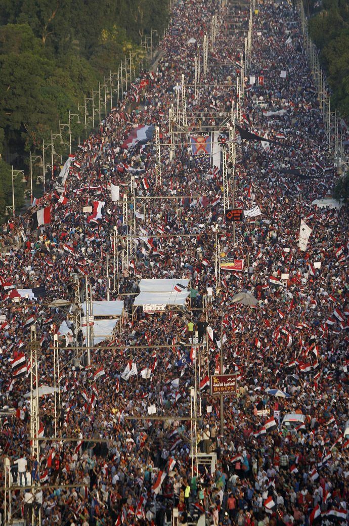 A
  general view of protesters opposing Egyptian President Mohamed
  Morsi waving Egyptian flags and shouting slogans against him and
  members of the Muslim Brotherhood, during a protest in front of
  El-Thadiya presidential palace in Cairo June 30, 2013. (Reuters)