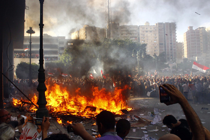 President Mohamed
  Morsi burn the content of a Freedom and Justice Party office in
  the coastal city of Alexandria on June 28, 2013. (AFP Photo)