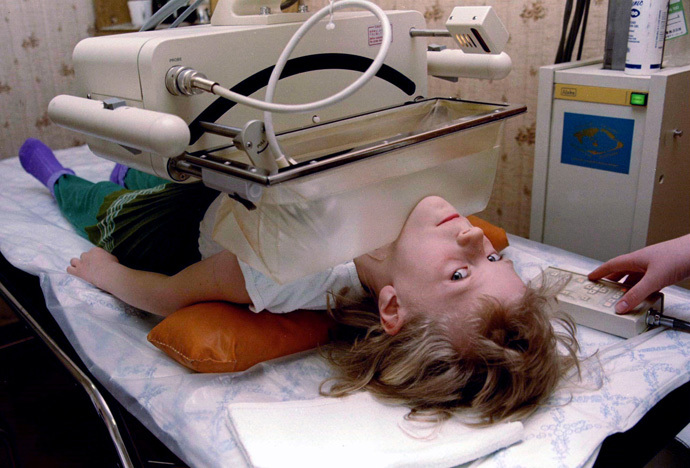 Olga Derzhutskaya, 6, undergoes medical observation after an operation for thyroid cancer at the ra diation medicine center in Gomel, April 9, 1996 (Reuters)